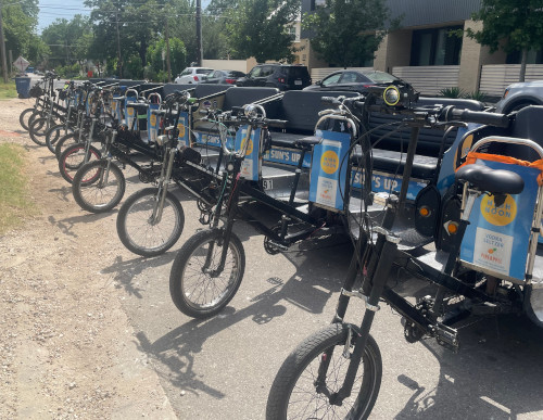 newly wrapped pedicabs all in a row